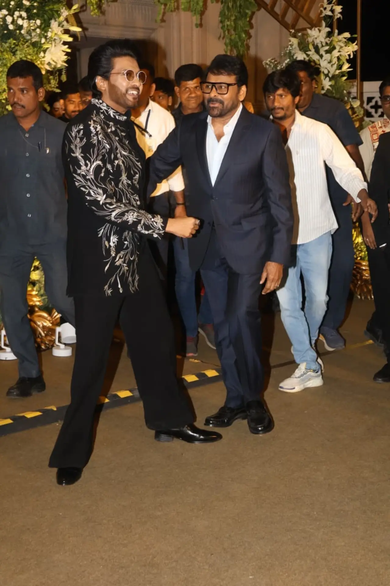 Chiranjeevi made a stylish entry at Vijay–Rashmika’s reception in a sharp black suit paired with a crisp white shirt. The megastar’s classic look exuded elegance.